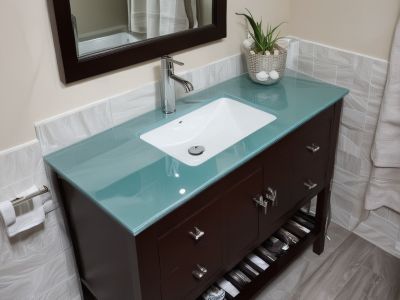 Modern bathroom vanity installation with quartz countertop and vessel sink